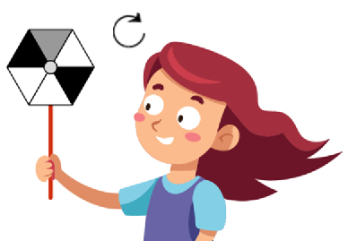 A girl holding a hexagonal windmill with 3 black and 3 white sections.